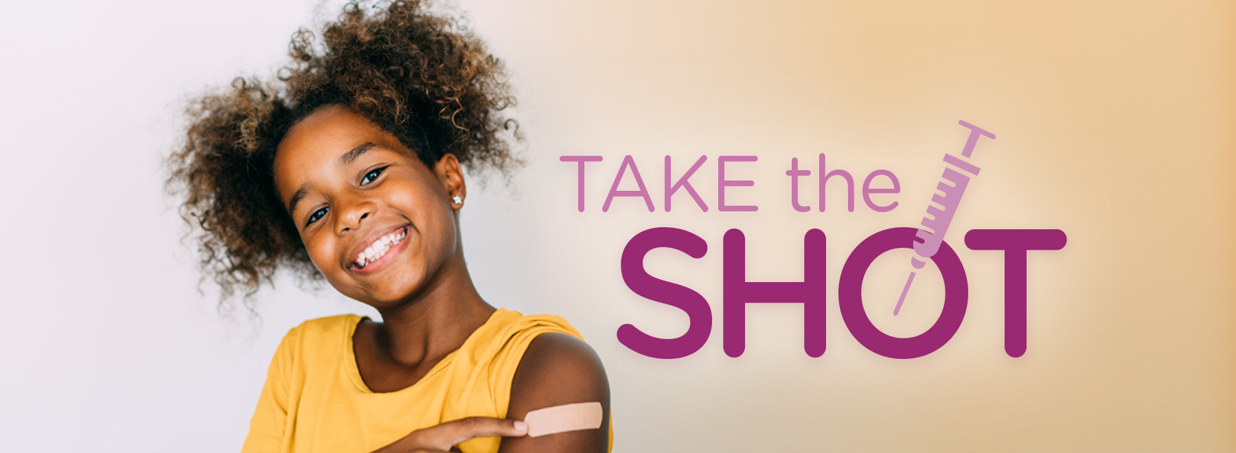 Happy child with a band-aid on their arm, symbolizing vaccination readiness for school.